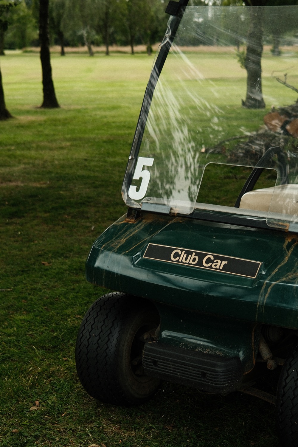 A Club Car golf cart waiting beneath the trees, Magnolia Classic, Horsforth Golf Club, Leeds
