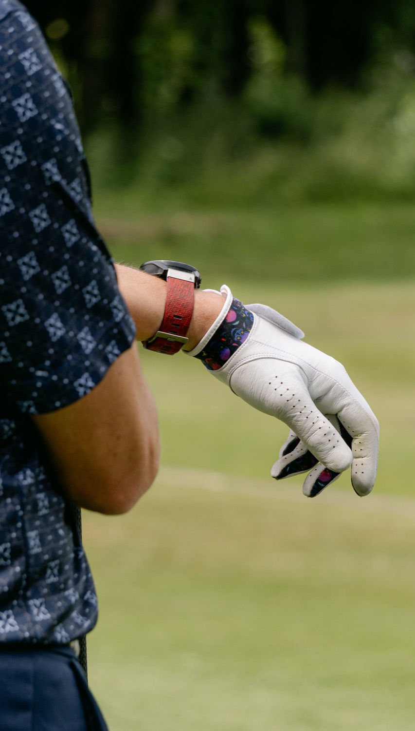 Arms folded over a glove and watch while another player takes a shot, Magnolia Classic, Horsforth Golf Club, Leeds