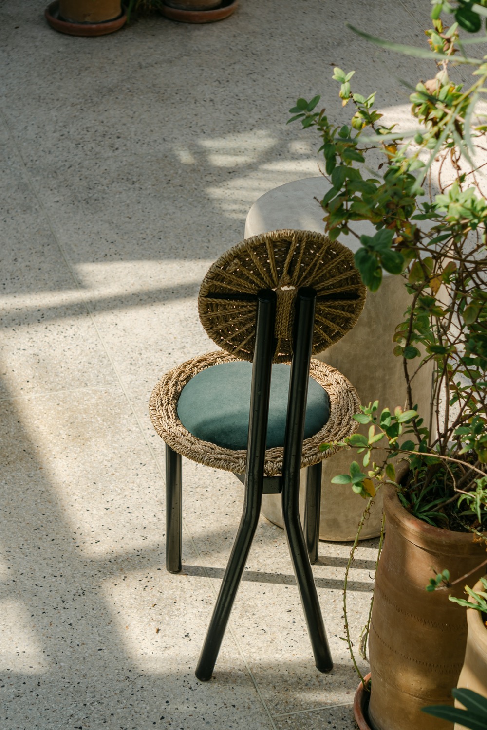Woven chair, terrazzo floor, Tangier, Morocco