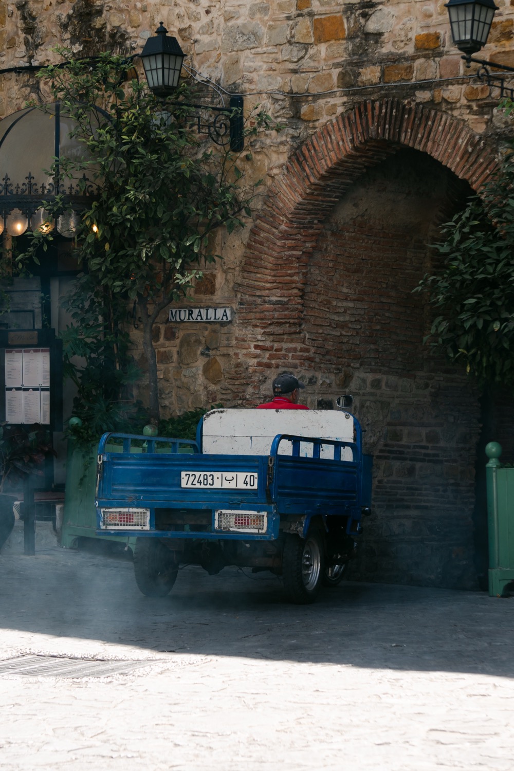Blue truck through the arch, Tangier, Morocco