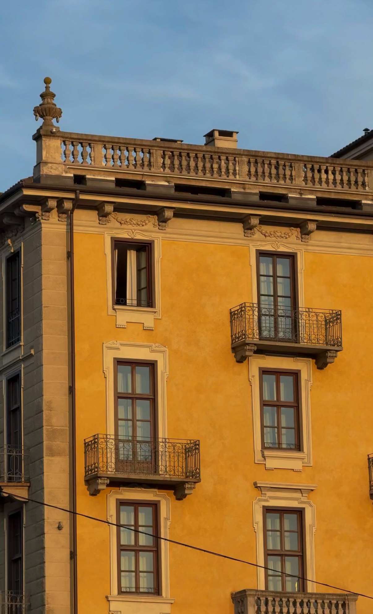 Yellow facade in golden evening light, Turin