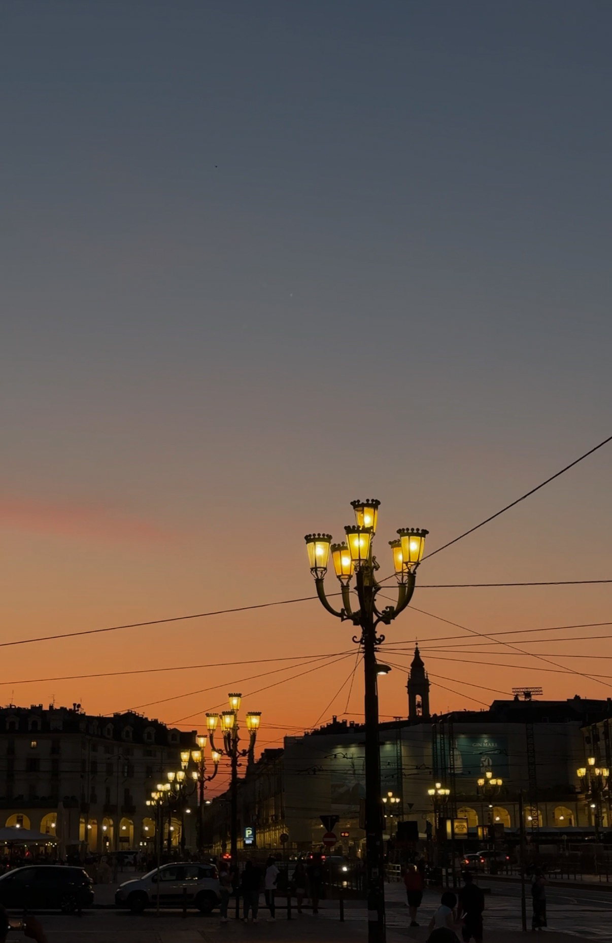 Evening street lamps at dusk, Turin