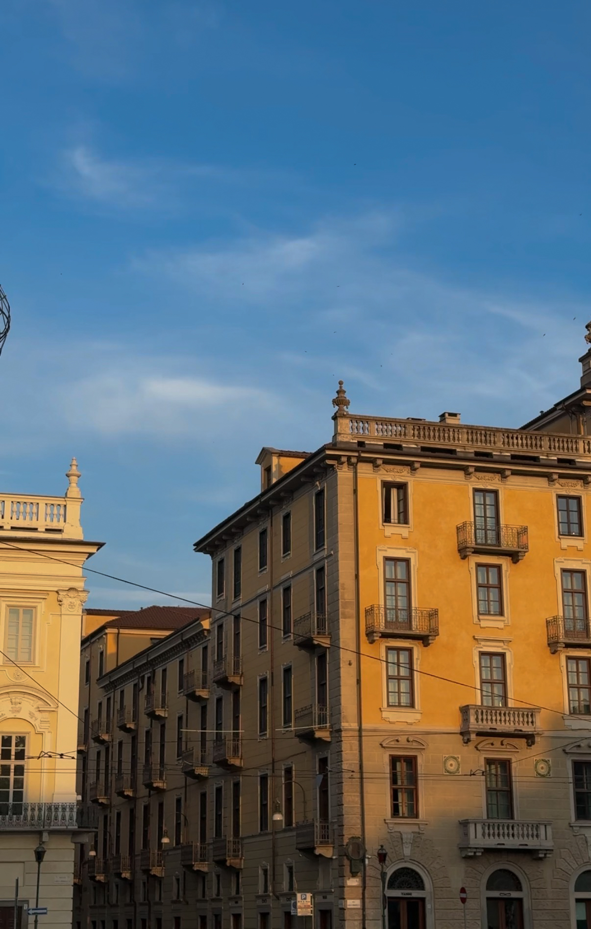 Wide piazza and yellow facades in evening light, Turin